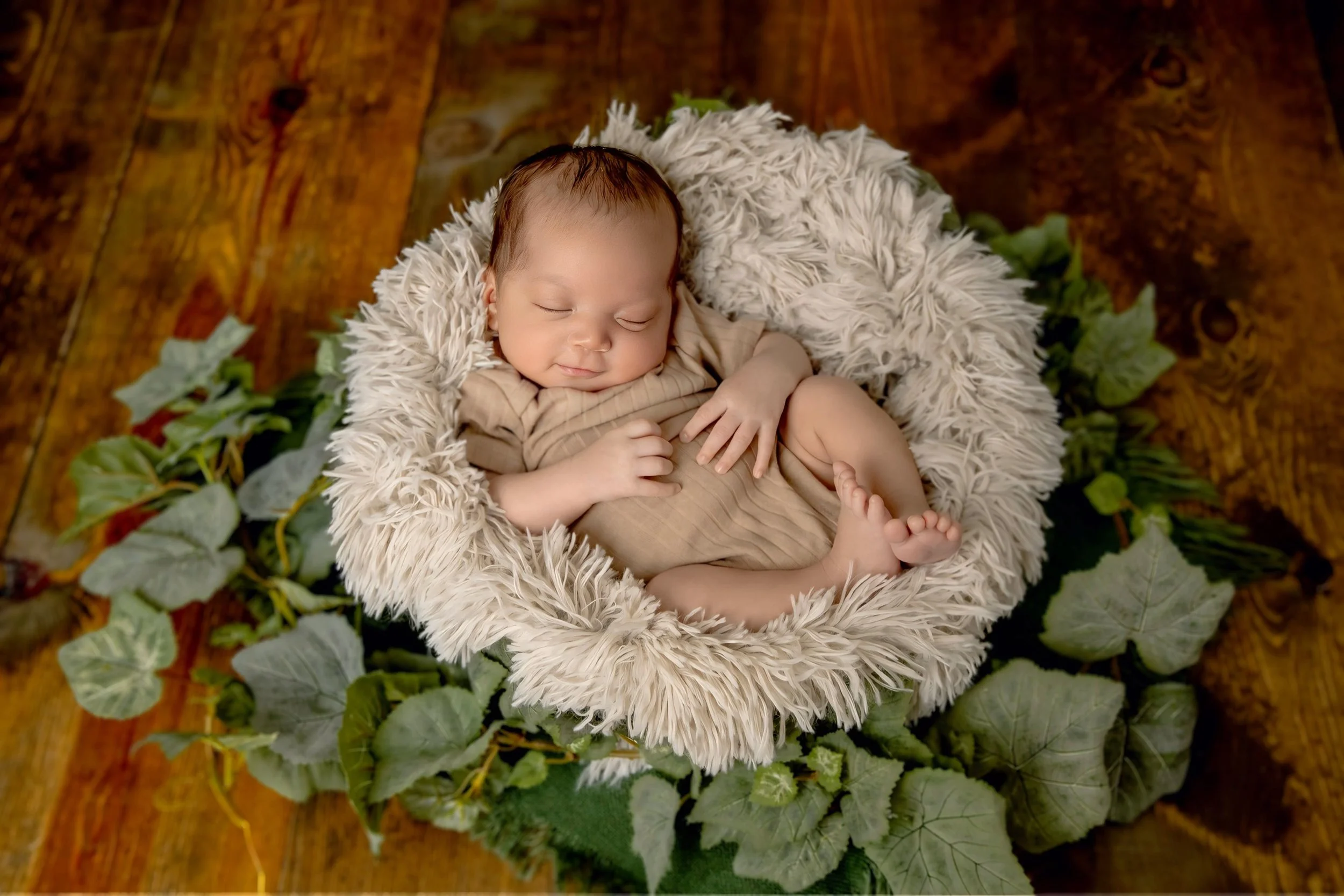 Omaha Newborn Photographer boy smiling in studio 