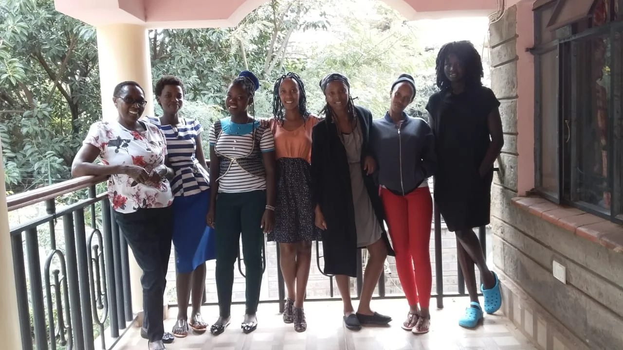 Illuminata (left) with some of the young women in RefuSHE’s programs