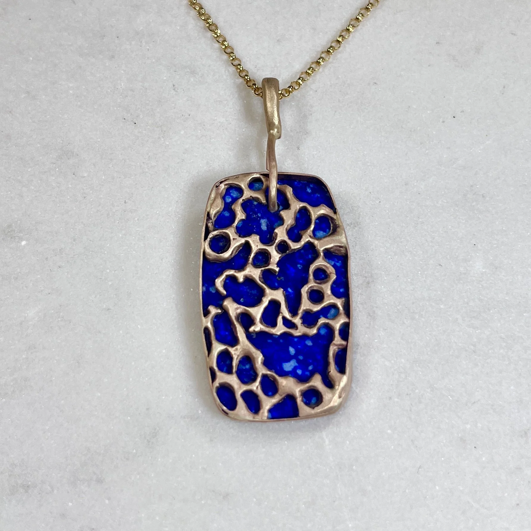 JCohnLapisTabletPendantNeckB.jpg