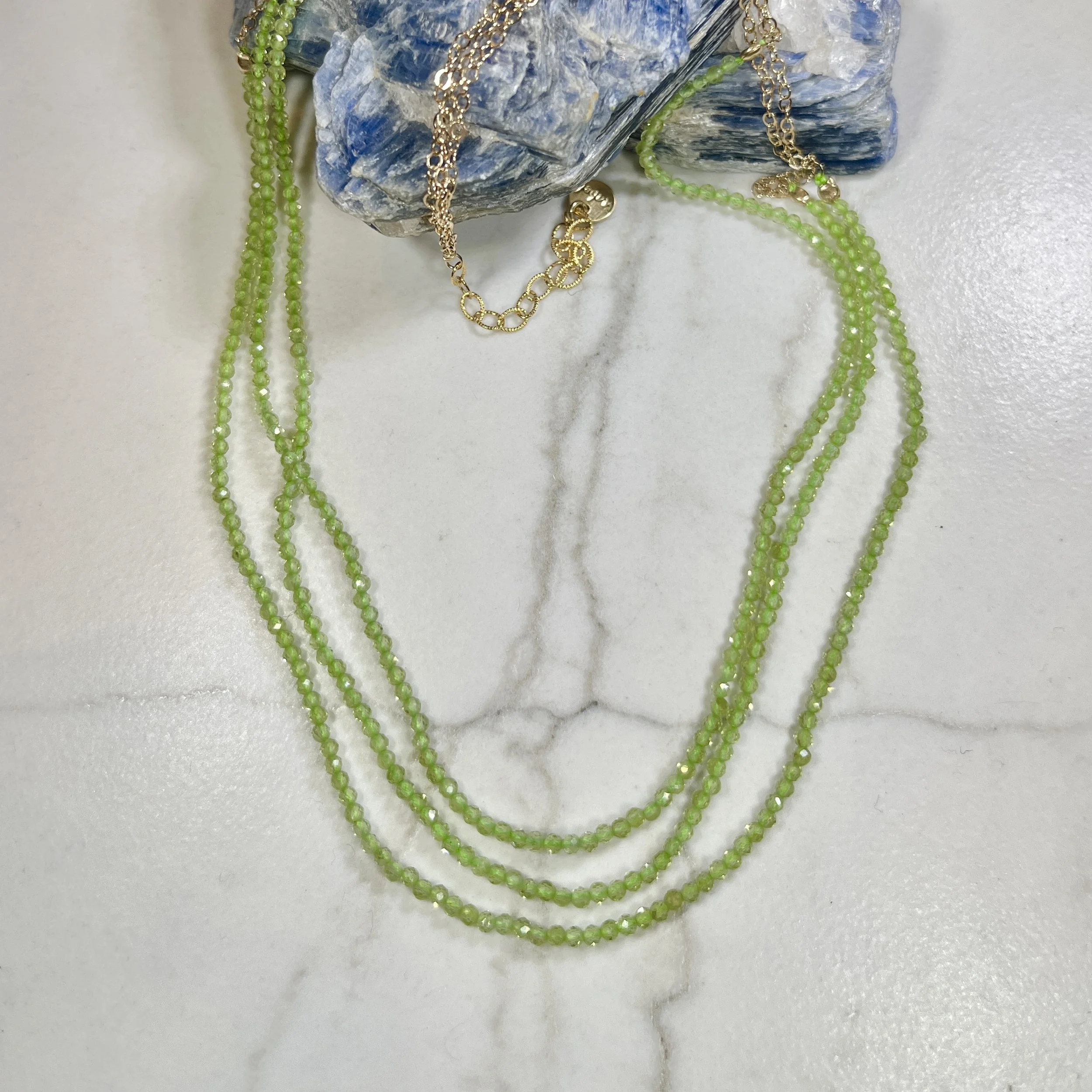 MChongTruplePeridotStrandNeck.jpg