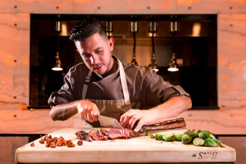 Chef Jean Delgado Shaving fresh meat at Toro Toro Miami
