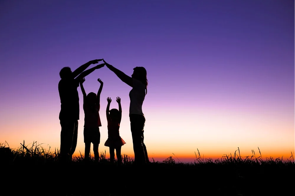 silhouette-of-family-playing-in-field-min.jpg
