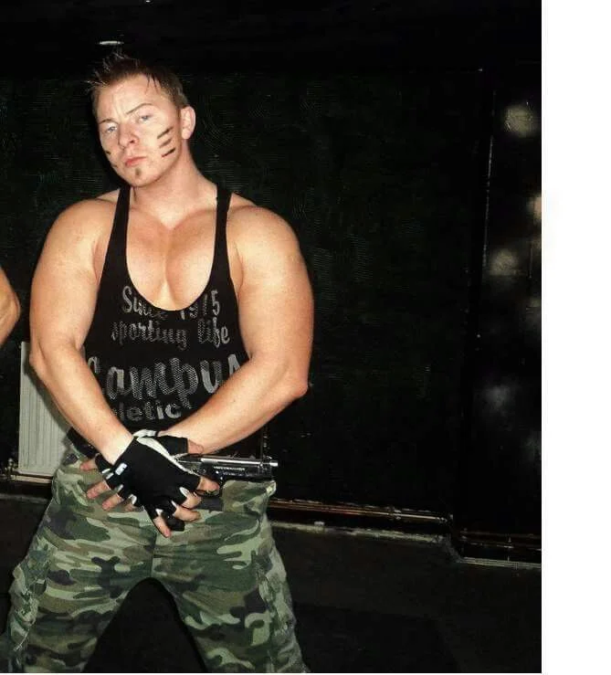 Example of a bad male strip costume - the top isn’t even part of the camo uniform.