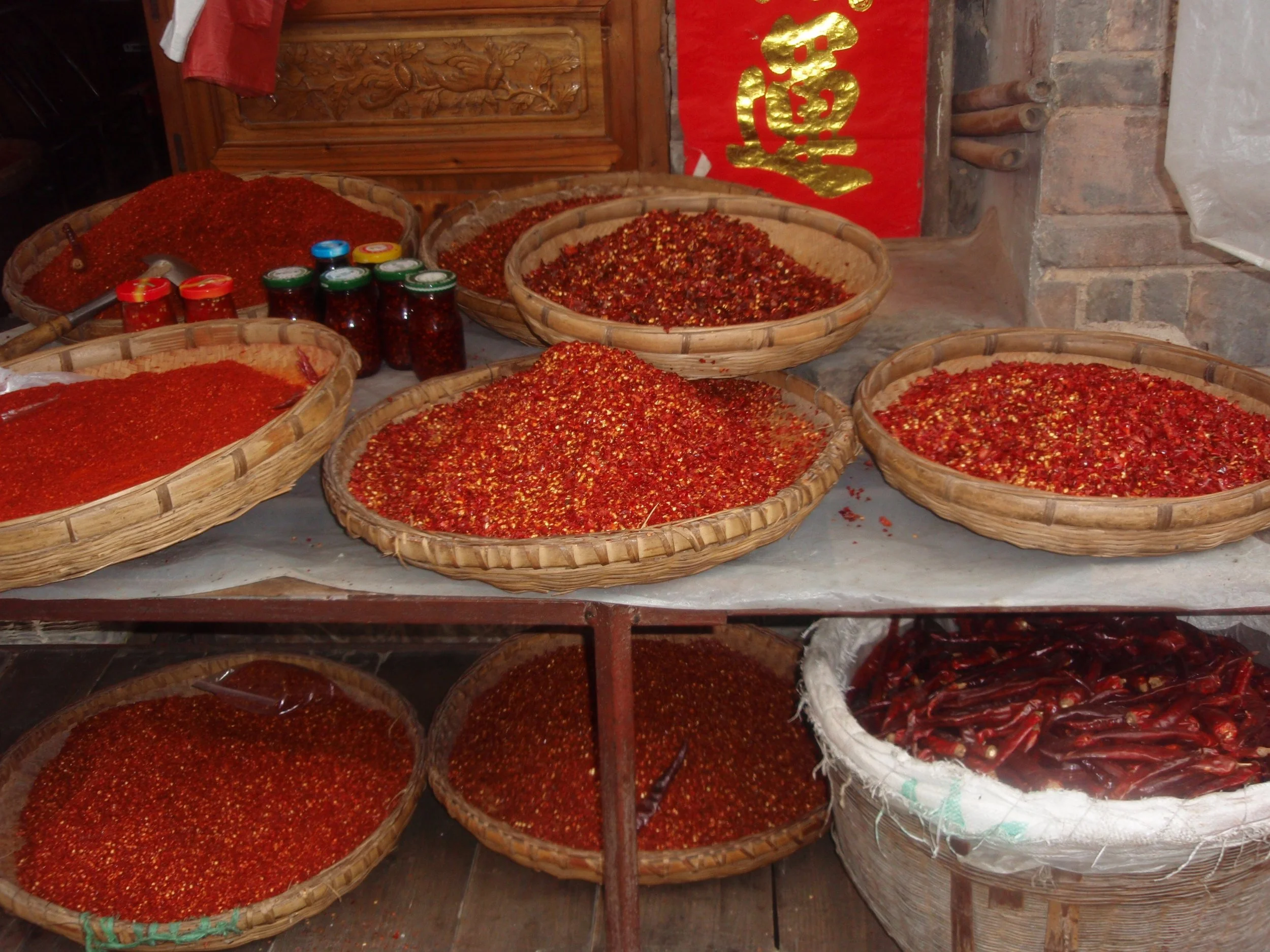 Jishou, Hunan: Dried chilies for sale in the morning market, Summer 2009