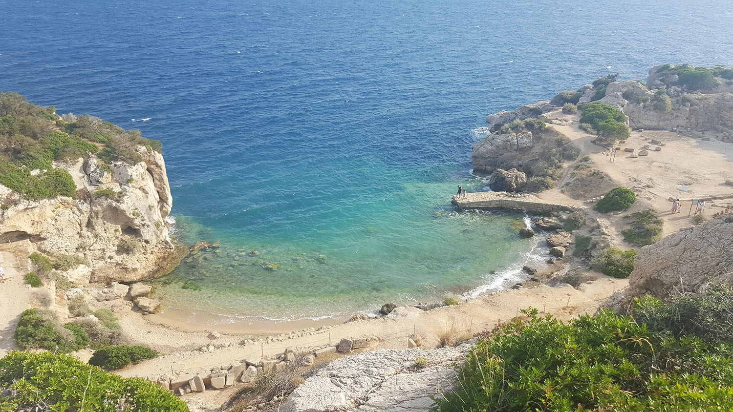 Heraion cove with people on pontoon.jpg