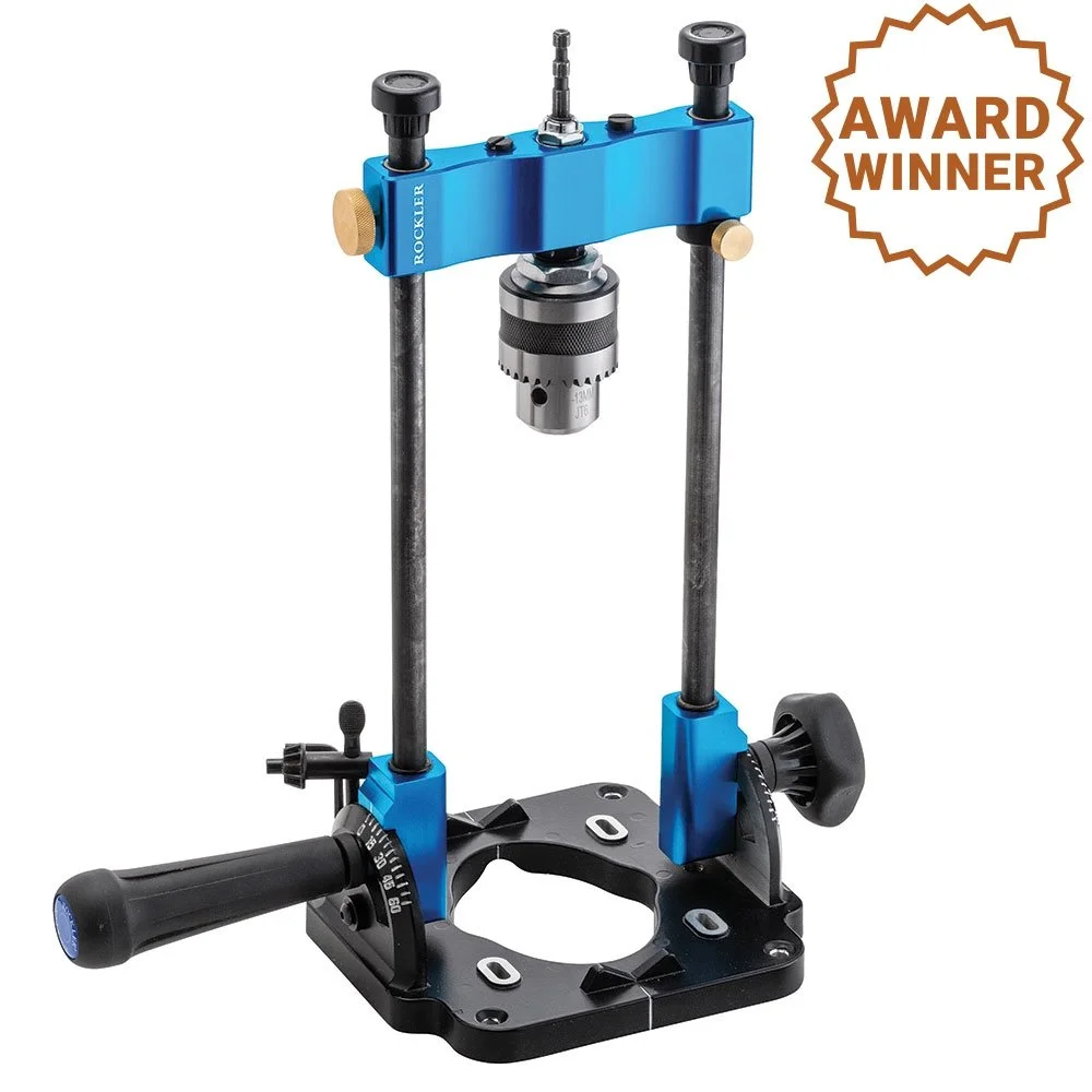 Rockler Portable Drill Guide with a 1/2 inch Jacobs chuck and red adjustment handles set up for precise angled drilling