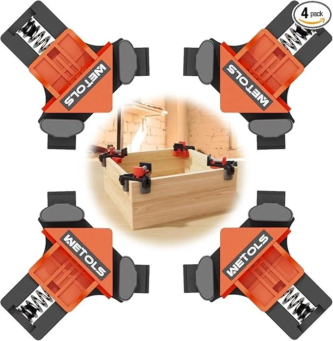 WETOLS 4 piece orange corner clamp set for woodworking showing spring loaded 90 degree right angle alignment on wood boards.
