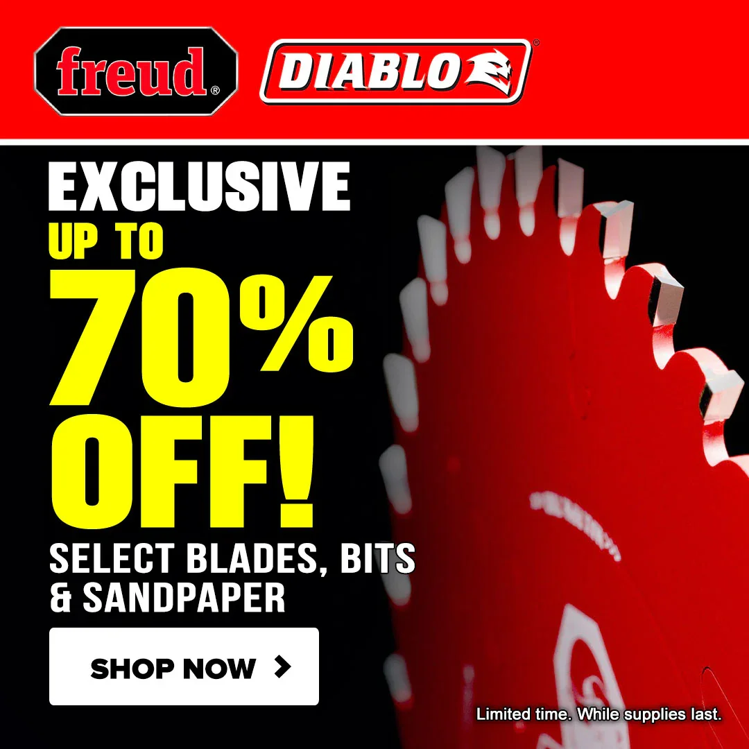 Selection of red Diablo circular saw blades and SandNet sanding discs on a wooden surface.