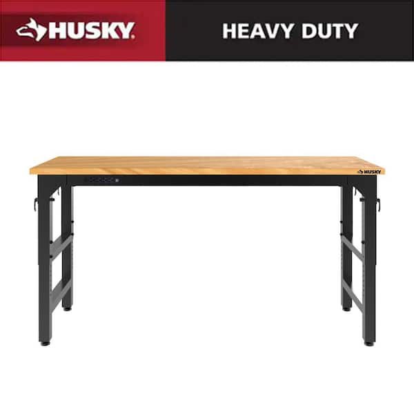 Husky 72 inch adjustable height black workbench with solid wood top and steel legs on sale for $296.10