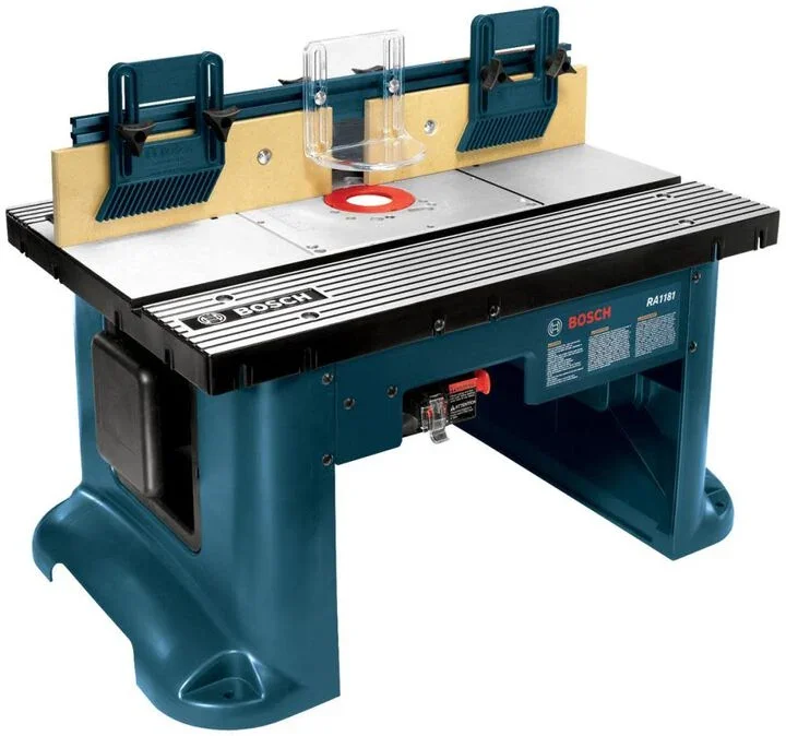 Reconditioned Bosch RA1181 benchtop router table with aluminum top and tall fence.