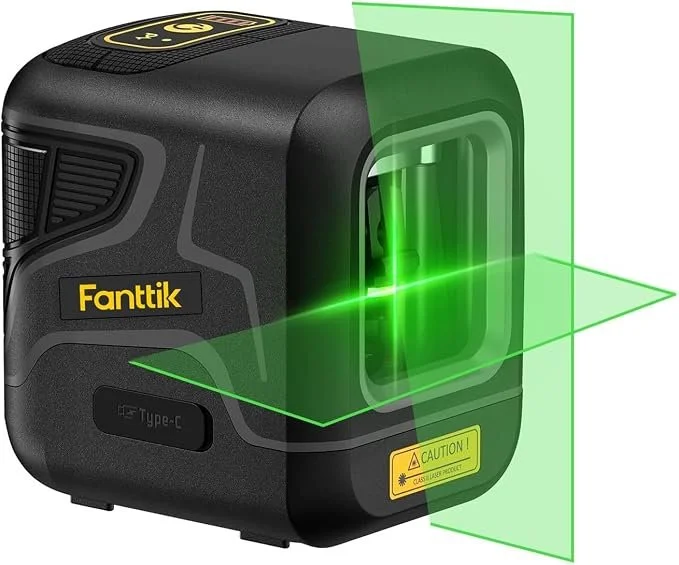 Fanttik D2 pocket green laser level on magnetic bracket projecting a green line for picture hanging