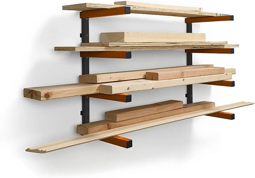 BORA PBR-0410 4 level orange and grey heavy duty wall mounted lumber storage rack holding wood boards in a garage workshop.