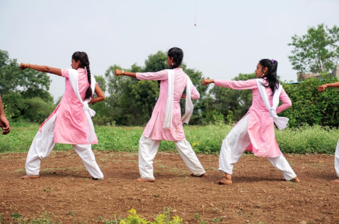 Image: Students giving a demonstration of the karate they have been taught as part of one of Ashta No Kai’s initiatives; used for self-defence from eve teasing. Photo credit: Antoinette Louw, 2018.