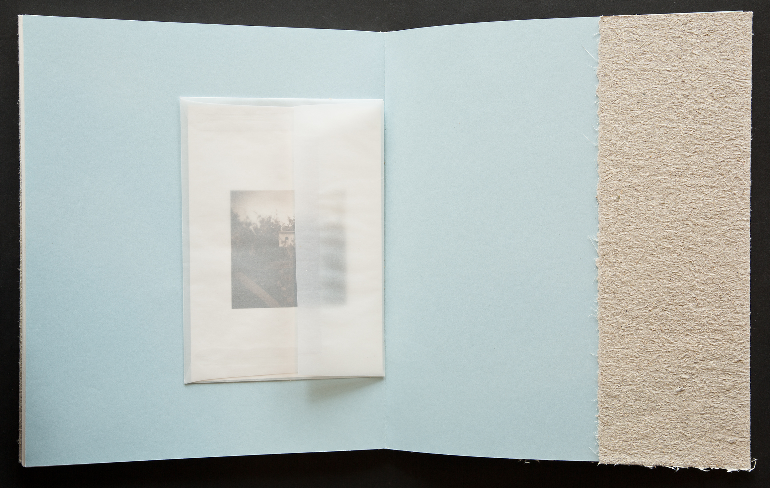  Each hand-sewn book includes a print suitable for framing inside a translucent envelop adhered to the inside back cover. 