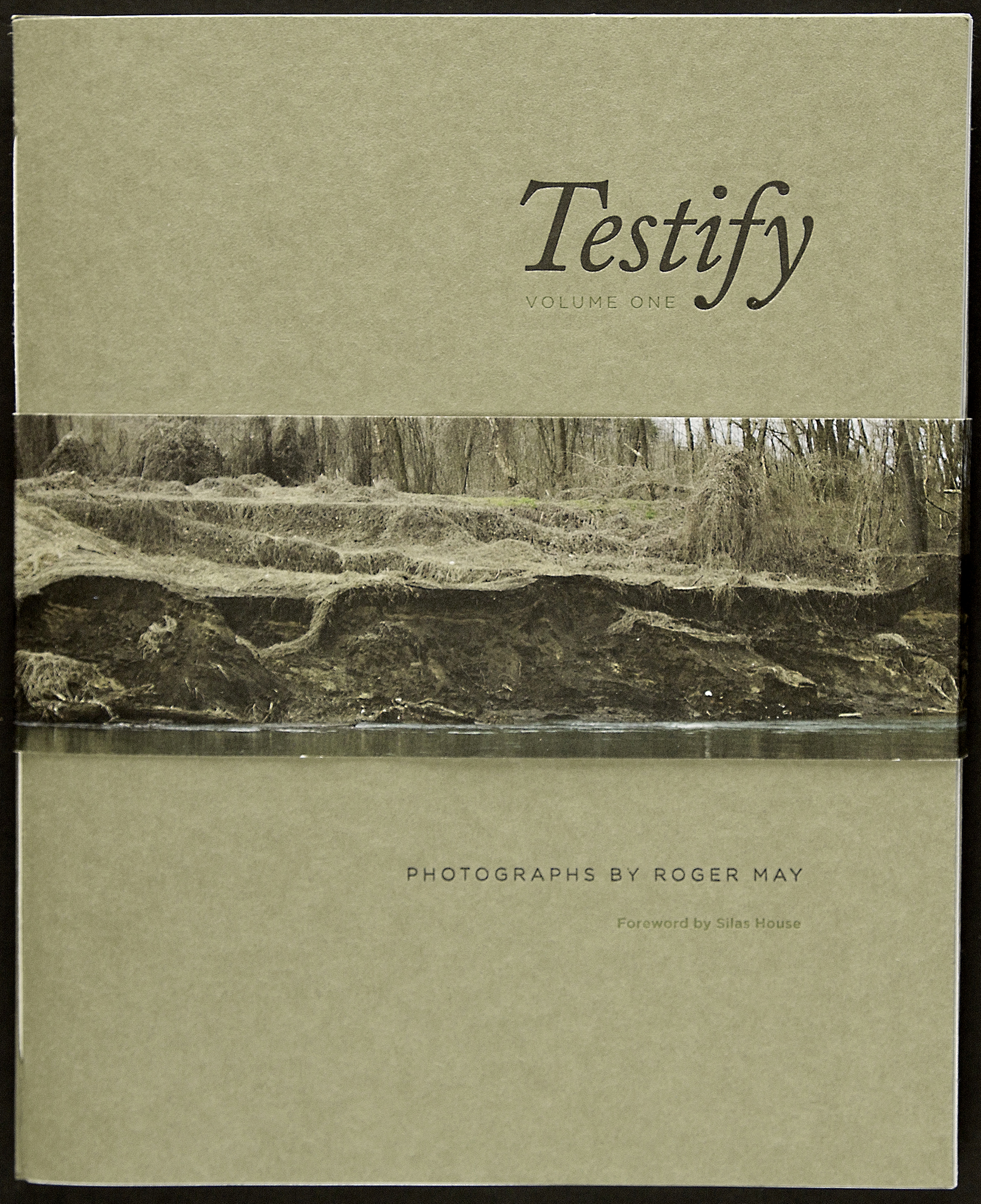  A printed bellyband holds the two volumes of this poetry collection together. The image is of the Tug River which separates West Virginia from Kentucky, the two states where Roger made the photographs in this collection. 
