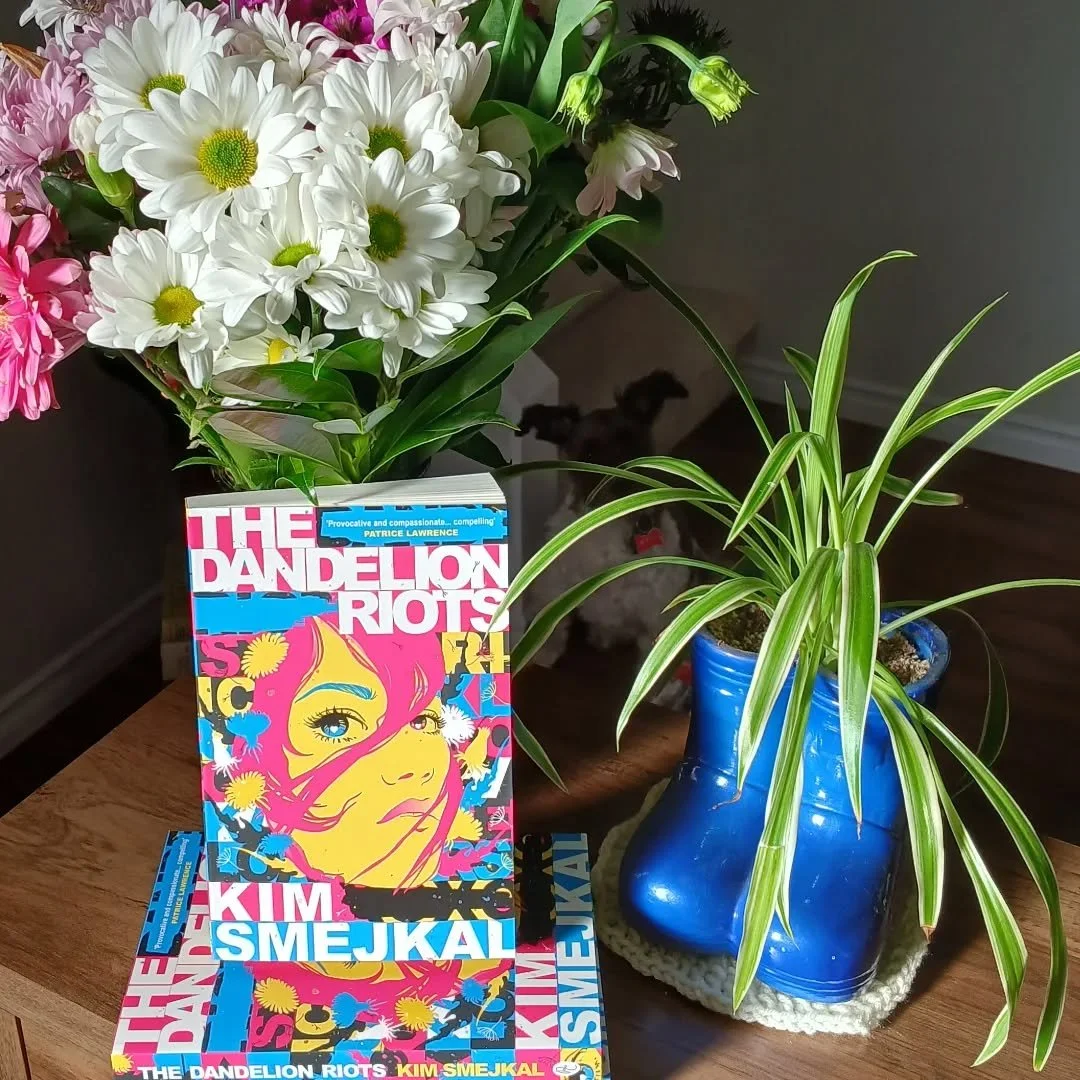 Happy book birthday to The Dandelion Riots, out today in the UK! I'm so proud of this book and the fierce dandelion girls who star in it.

This is a book about resistance, community, and standing up for humanity and justice in the face of seemingly i