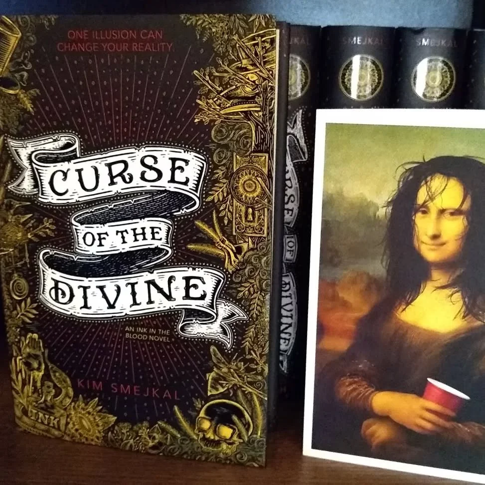 I'm a little late celebrating this book, but Curse of the Divine just had a birthday too! Here is a picture of my second book baby and what I looked like for most of the time I was writing it 🤣 (seriously though, second books are hard).

This book f