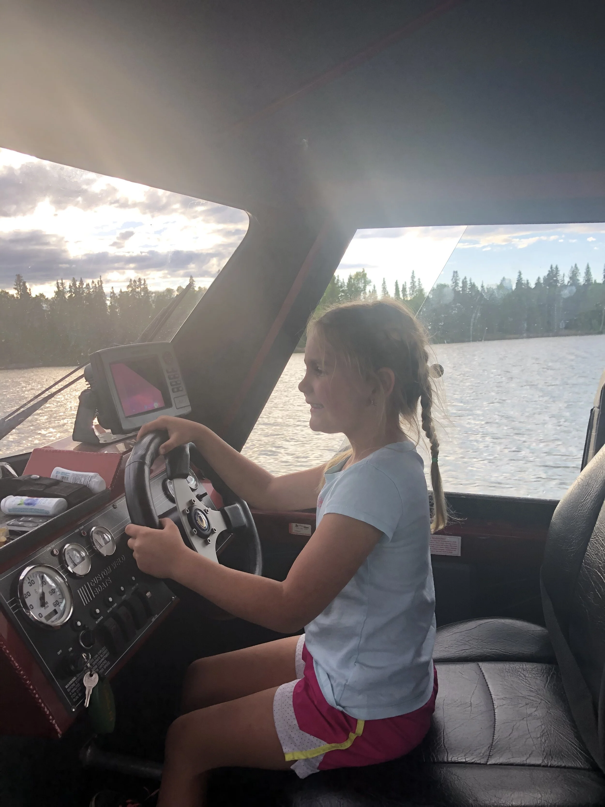 Britt Driving Boat.JPG