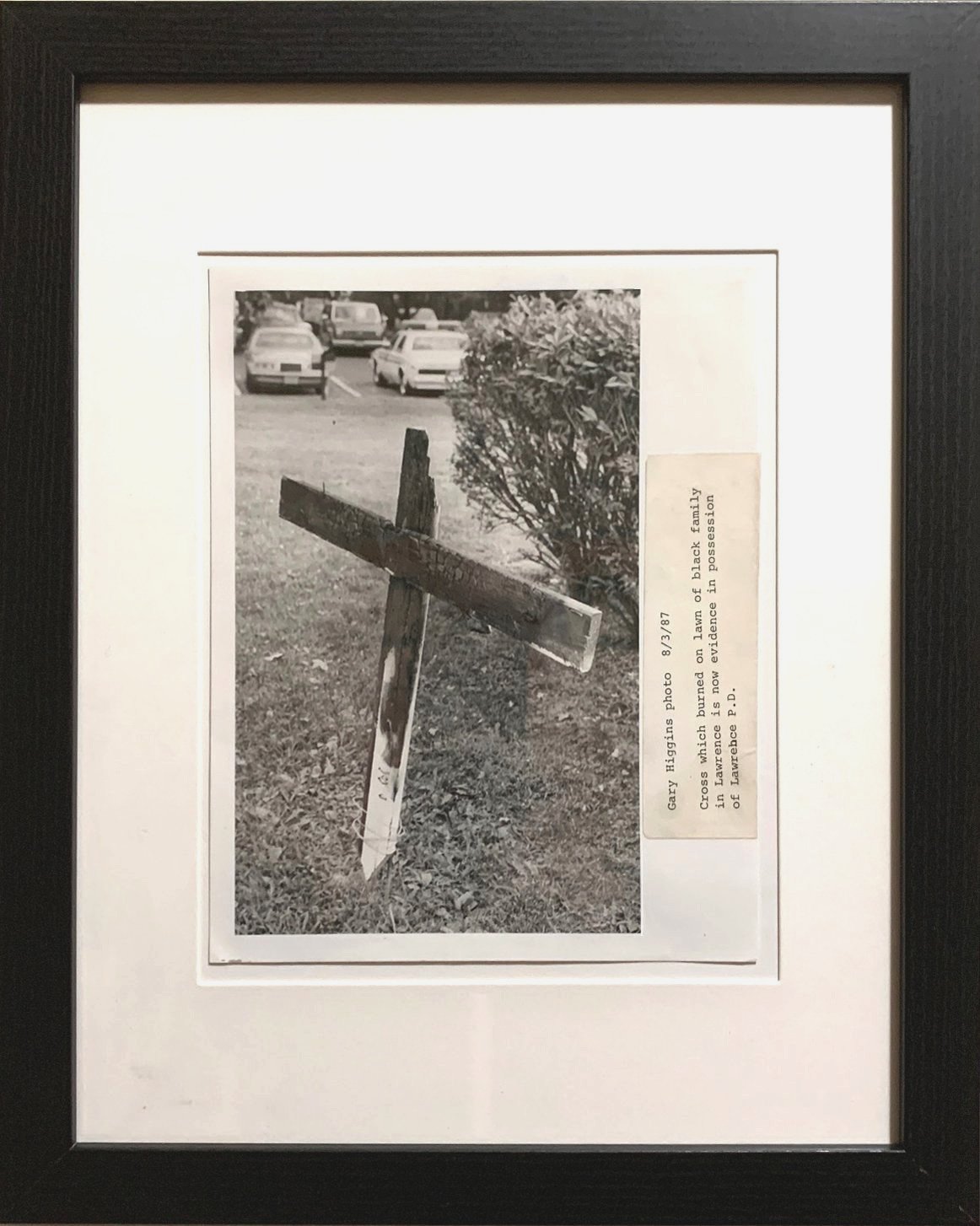 1. 8/3/87 - Cross which burned on lawn of black family in Lawrence is now evidence in possession of Lawrence P.D., Lawrence, Kansas