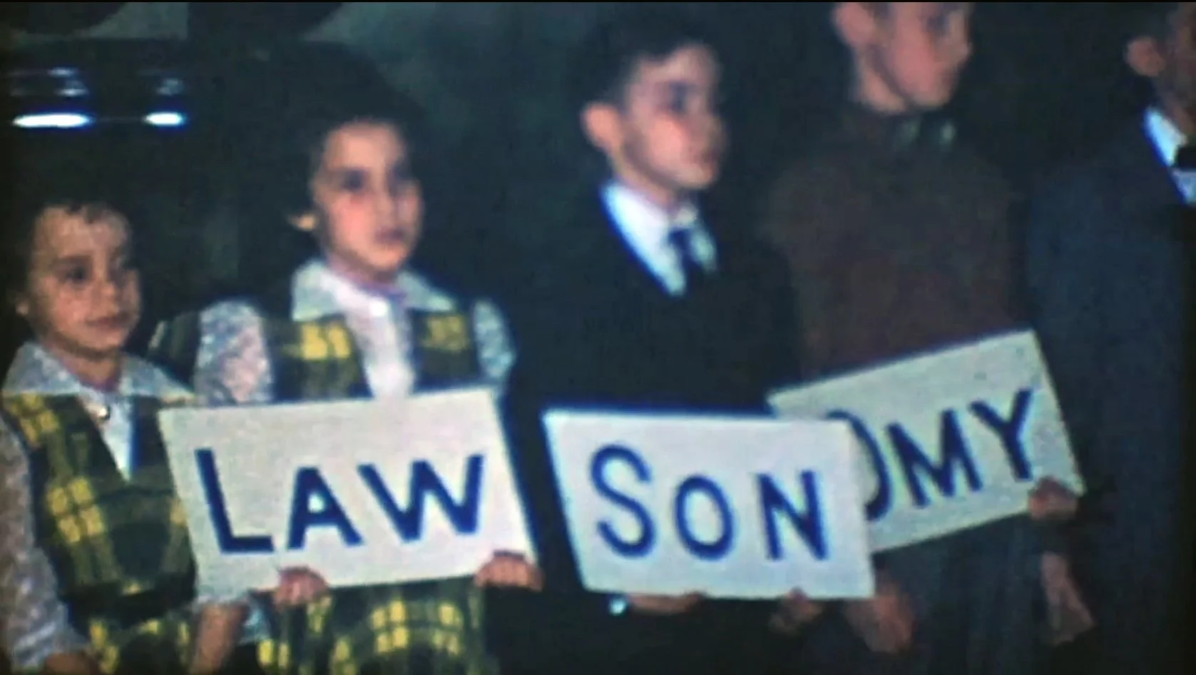 lol_trailer_kids_with_sign.jpg