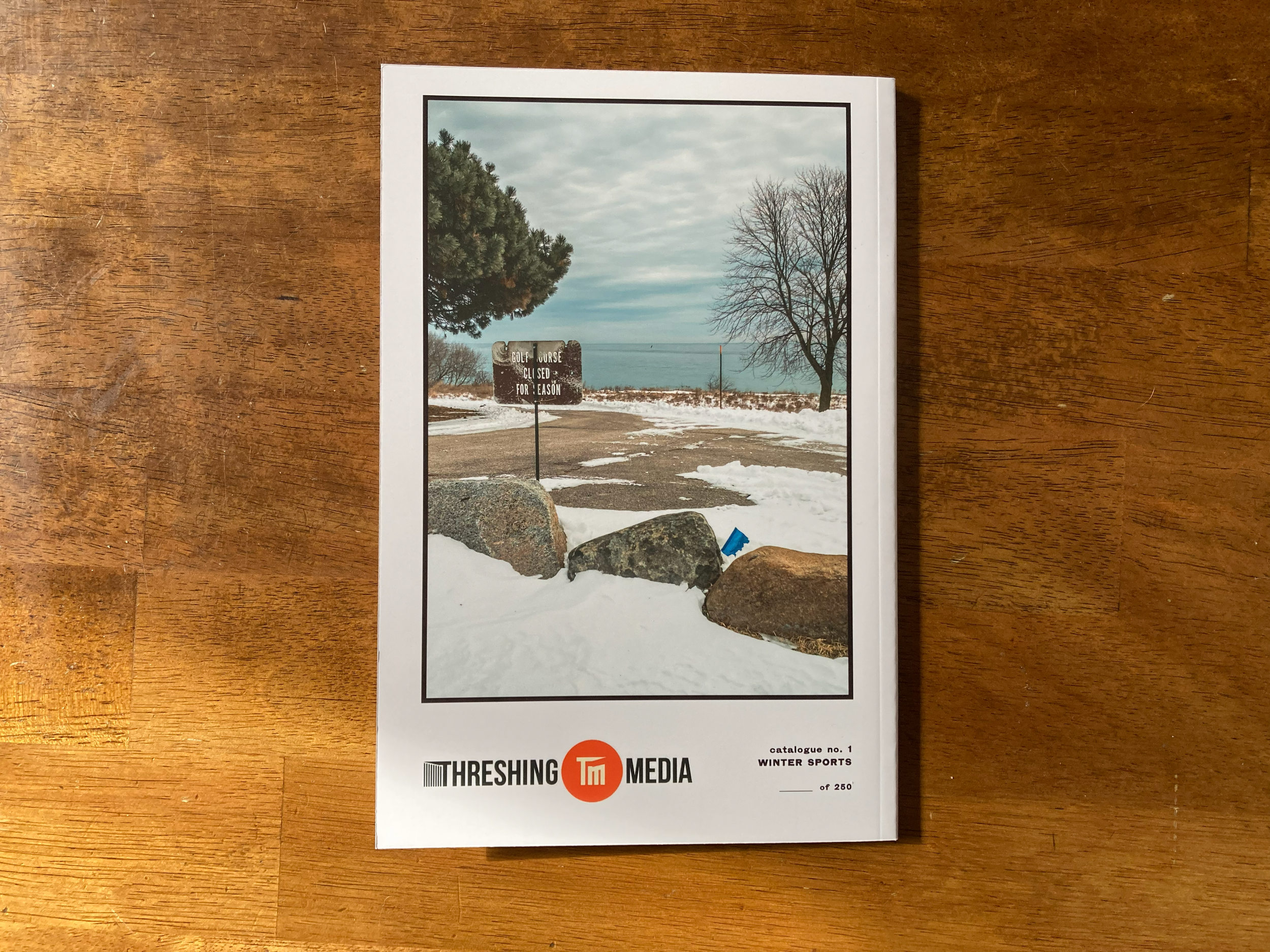 TMC_001_Back Cover on Table_land.png