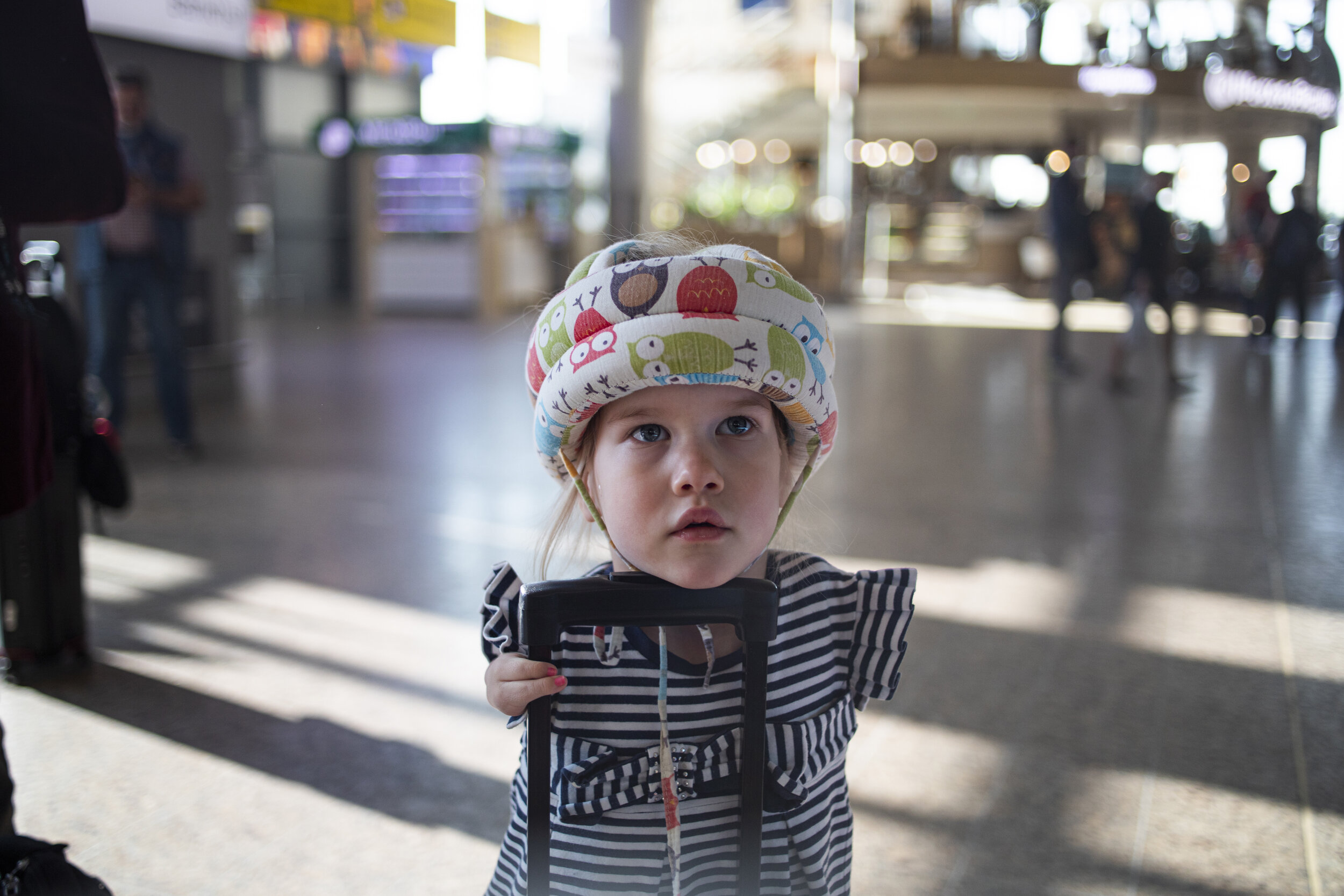  Vasilina Knutzen (4) holds a suitcase handle at Sheremetyevo Aiport in Moscow, Russia June 7, 2019. Her family is preparing to travel from their home in Moscow to the United States so that their adopted children, Vasilina and Denis, can obtain U.S.-