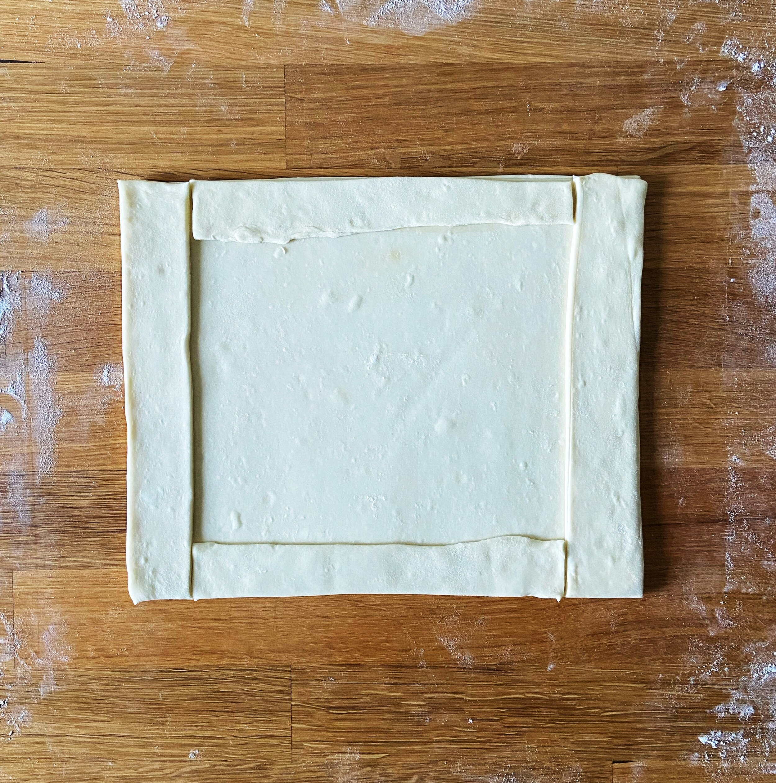 cut strips and place them on top of the dough, trim edges