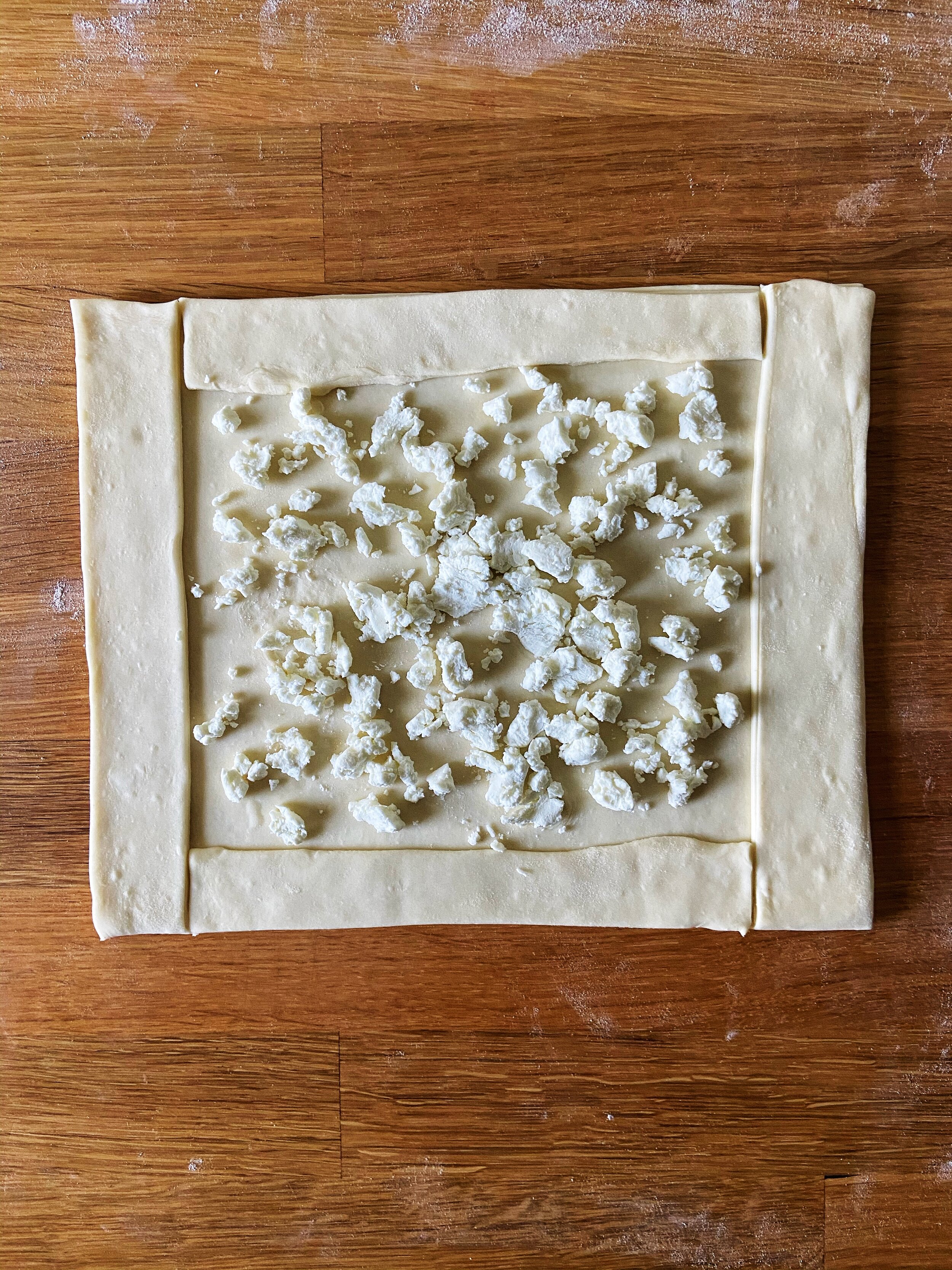sprinkle goat cheese over the center of the pastry