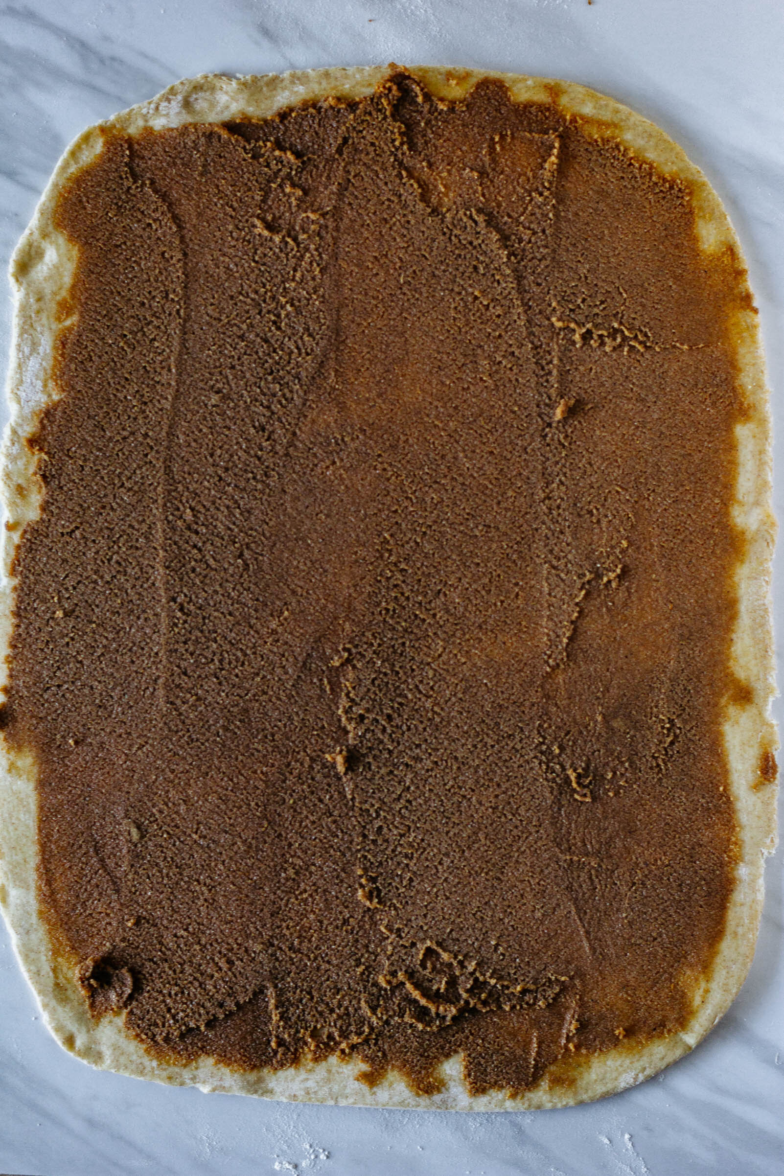 smear surface of the dough with filling
