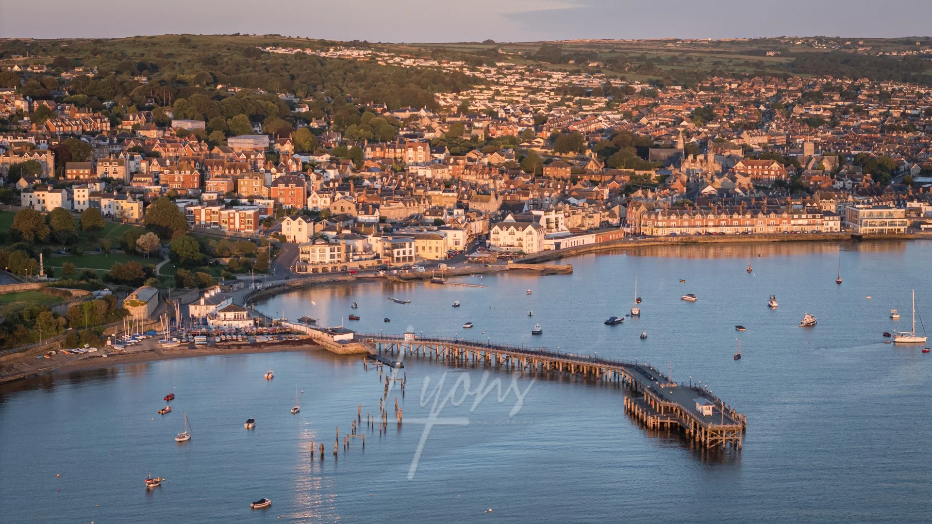 The piers and Swanage at sunrise