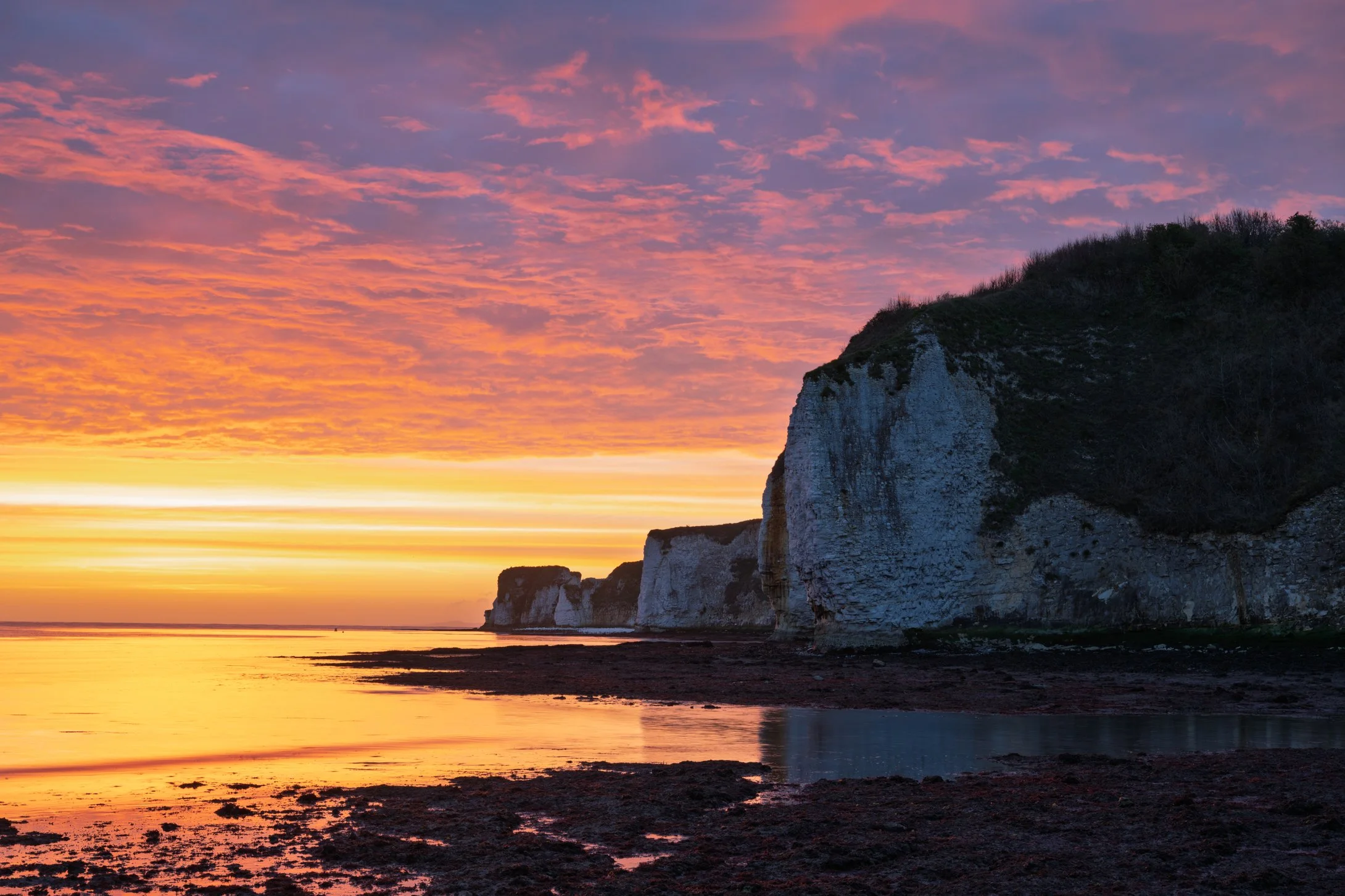 Colourful sunrise down with Old Harry