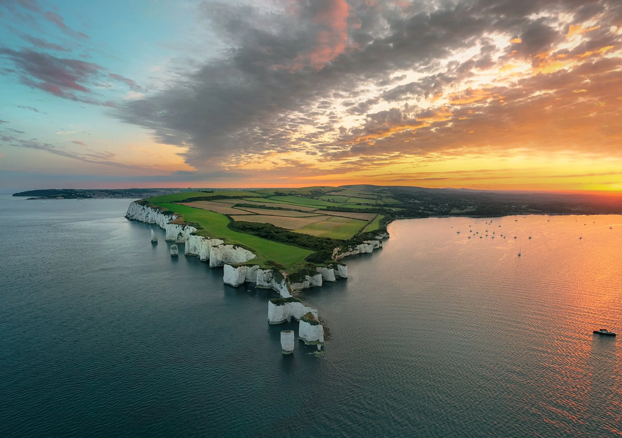 Summer sunsets over Old Harry and Studland Bay