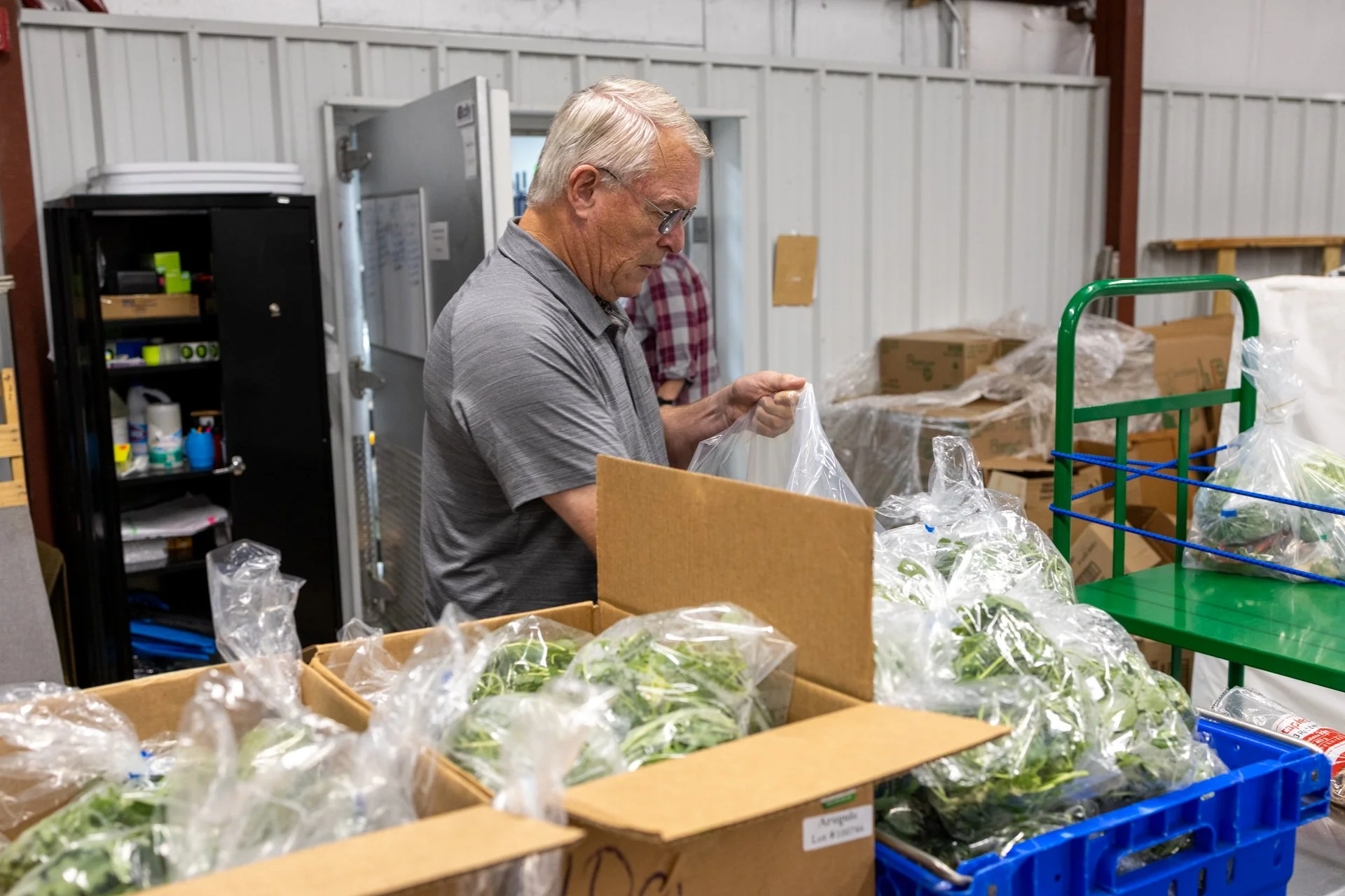 Jim packing produce boxes-5.jpg