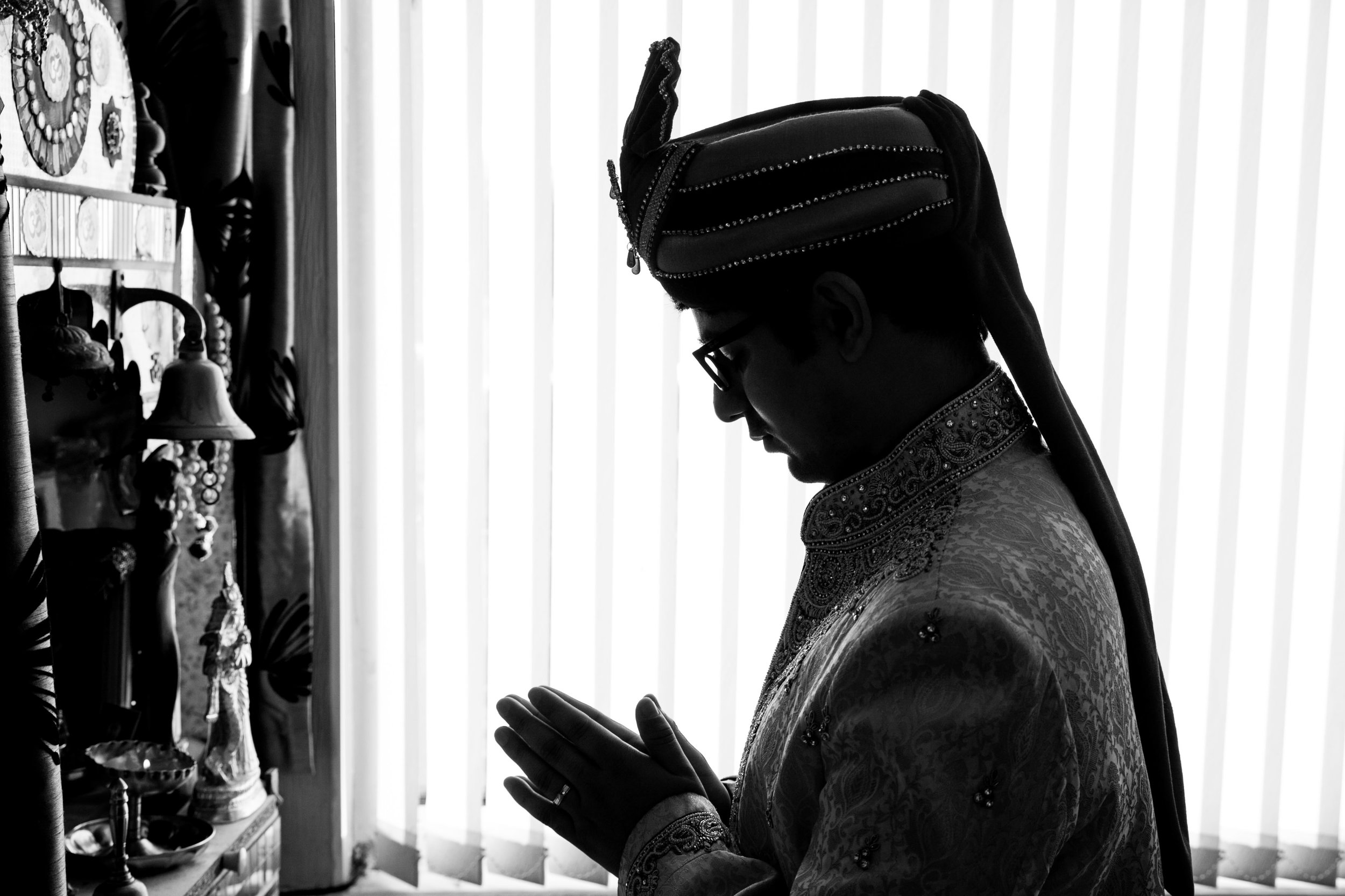 asian-Hindu-wedding-photographer-london-natalia-smith-photography-groom-praying-16.jpg