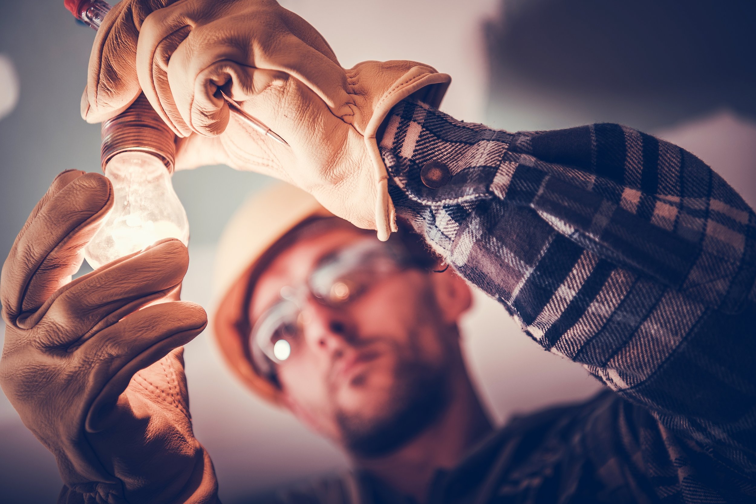 bigstock-Electrician-Fixing-The-Light-I-244239052.jpg
