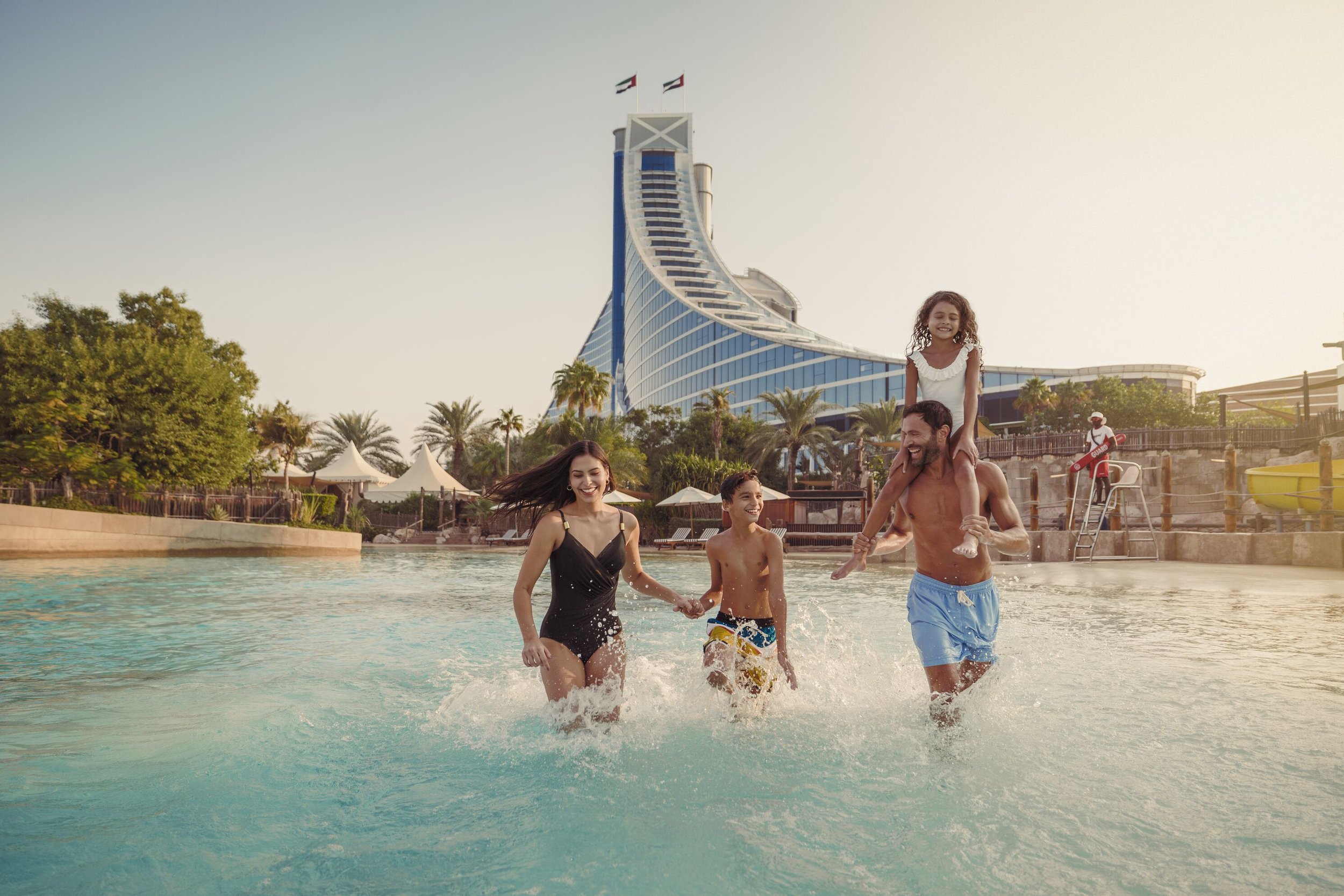 Medium_resolution_150dpi-Jumeirah Beach Hotel - Lifestyle - Play - Wave Pool - Family Running Wide.jpg