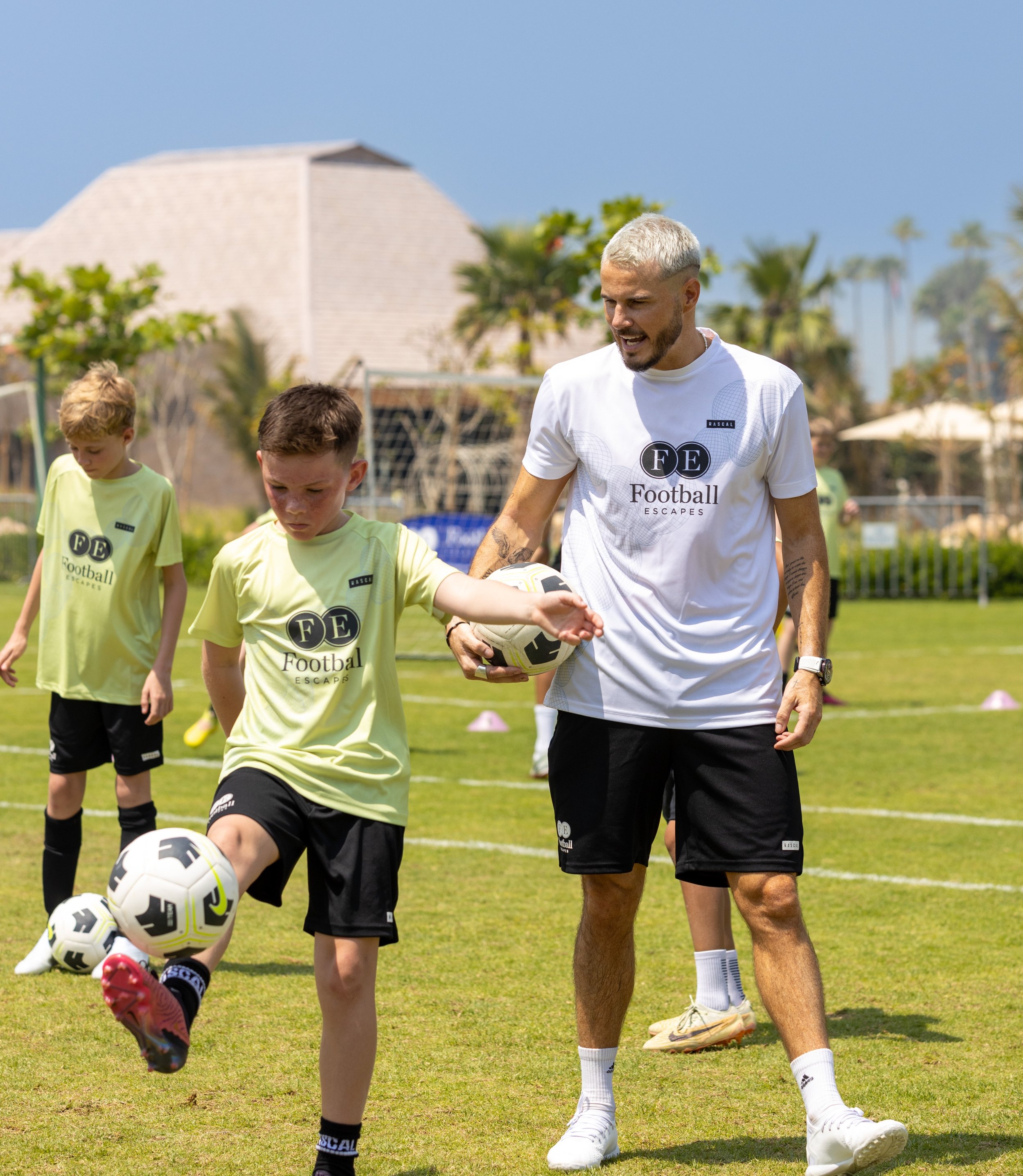 Robbie Keane all smiles as he plays ball with David Beckham