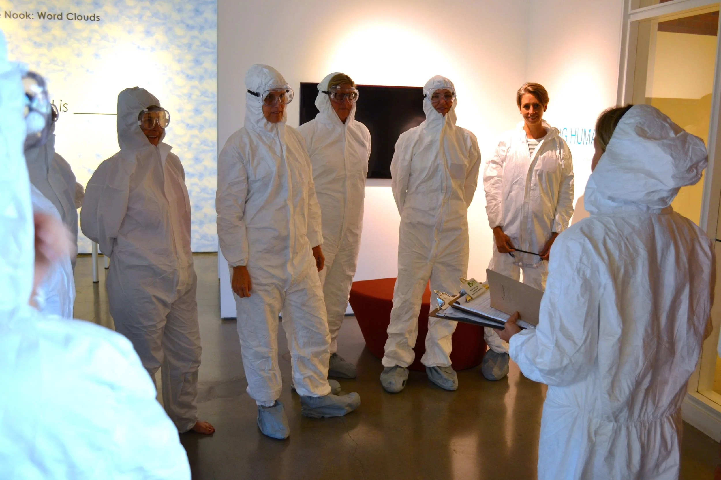After writing their “rebirth” announcements, participants read them to our group and then celebrated this declaration by crawling through a giant, modernist birth tunnel while simultaneously being sprayed with primary colored paint.