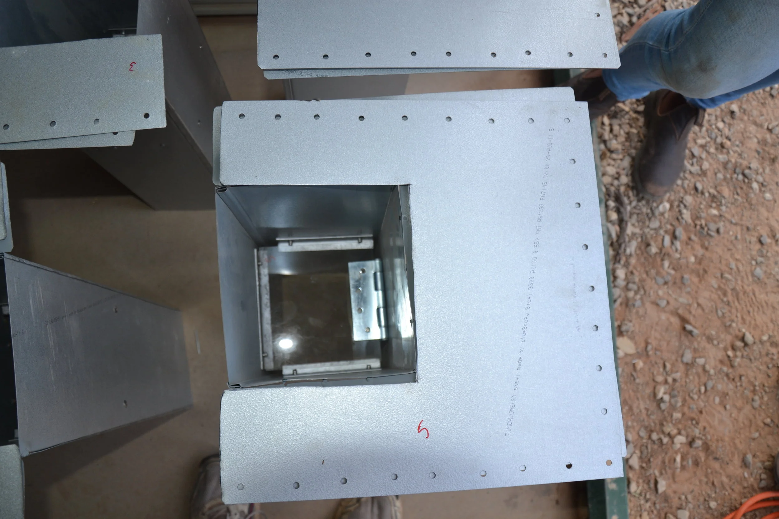 A research project to help make the native mammals more cautious of feral animals required the building of one way gates that were installed in the fence.