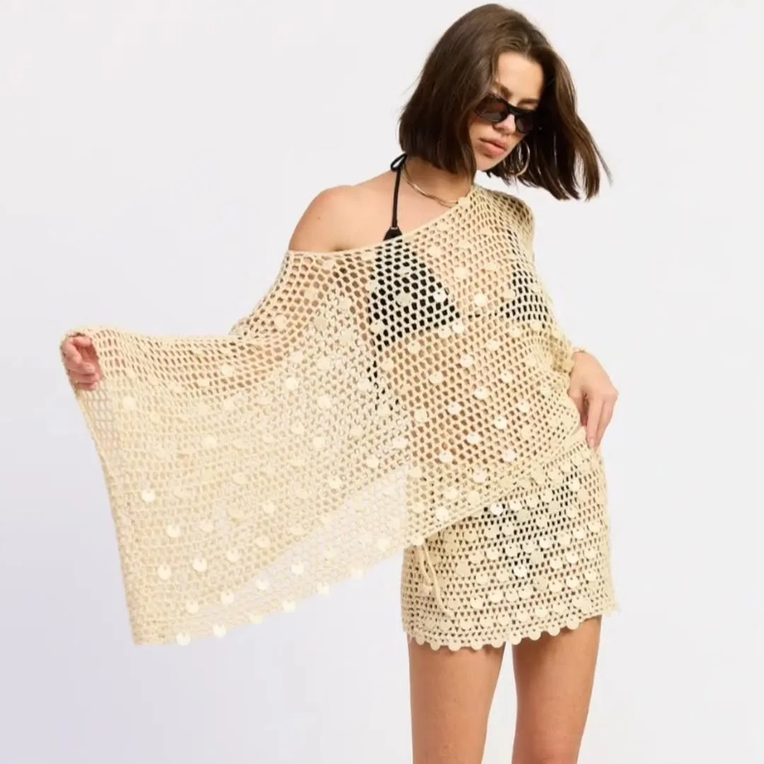 Our one-shoulder crochet top, sprinkled with delicate sequins, is made to shine from sunlit days to golden hour nights.

Style it over your fave bikini or dress it up for a chic resort look.

 #beachstyle #resort #vacationoutfit