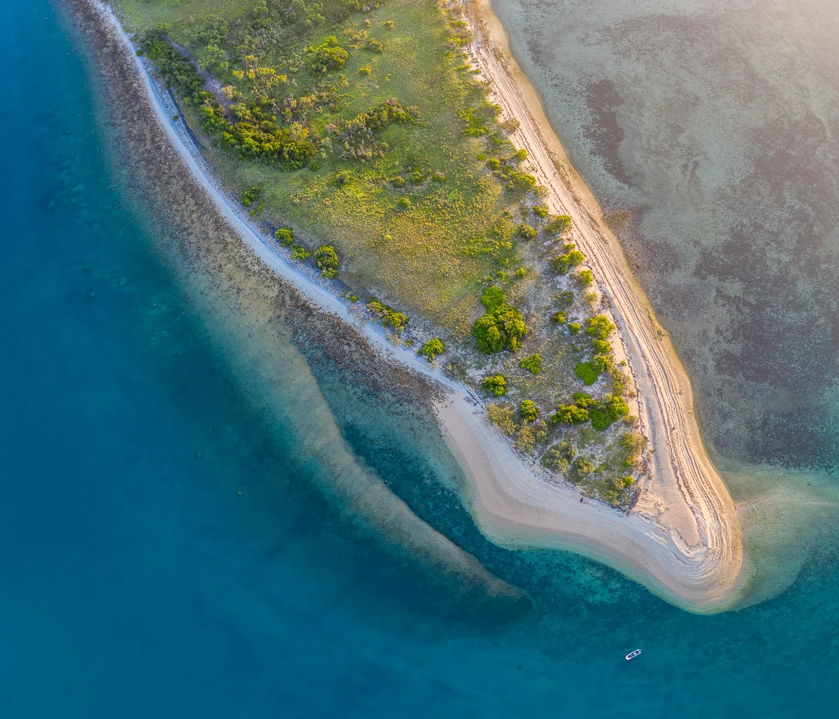 Saddleback Island spit showing the rubble bank pushed up by Cyclone Debbie (pale tongue on left)