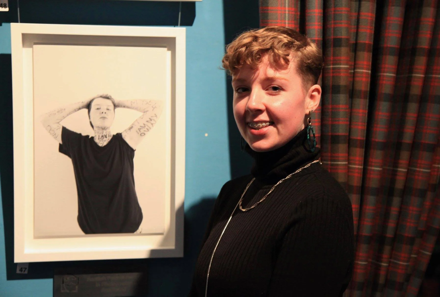 Eliza and her portrait at the SPA exhibition in Edinburgh, November 2018