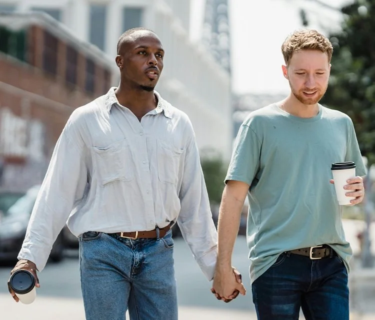 two gay men holding hands