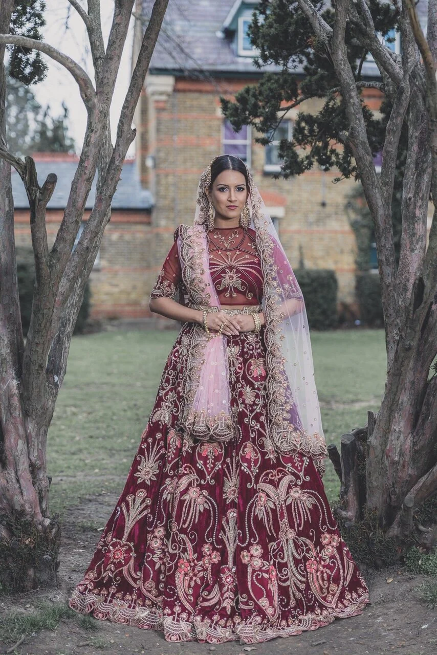 Sabyasachi bride photographing between two trees