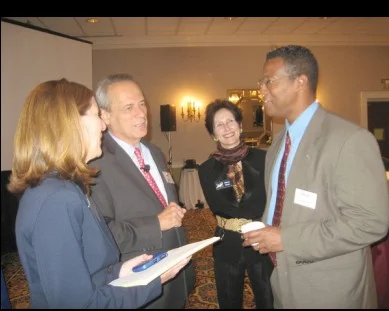 Duby McDowell, from left, greets her former teacher, Red Sox CEO Larry Lucchino, with MetroHartford Alliance vice president Nancy Wheeler and attorney George Springer.