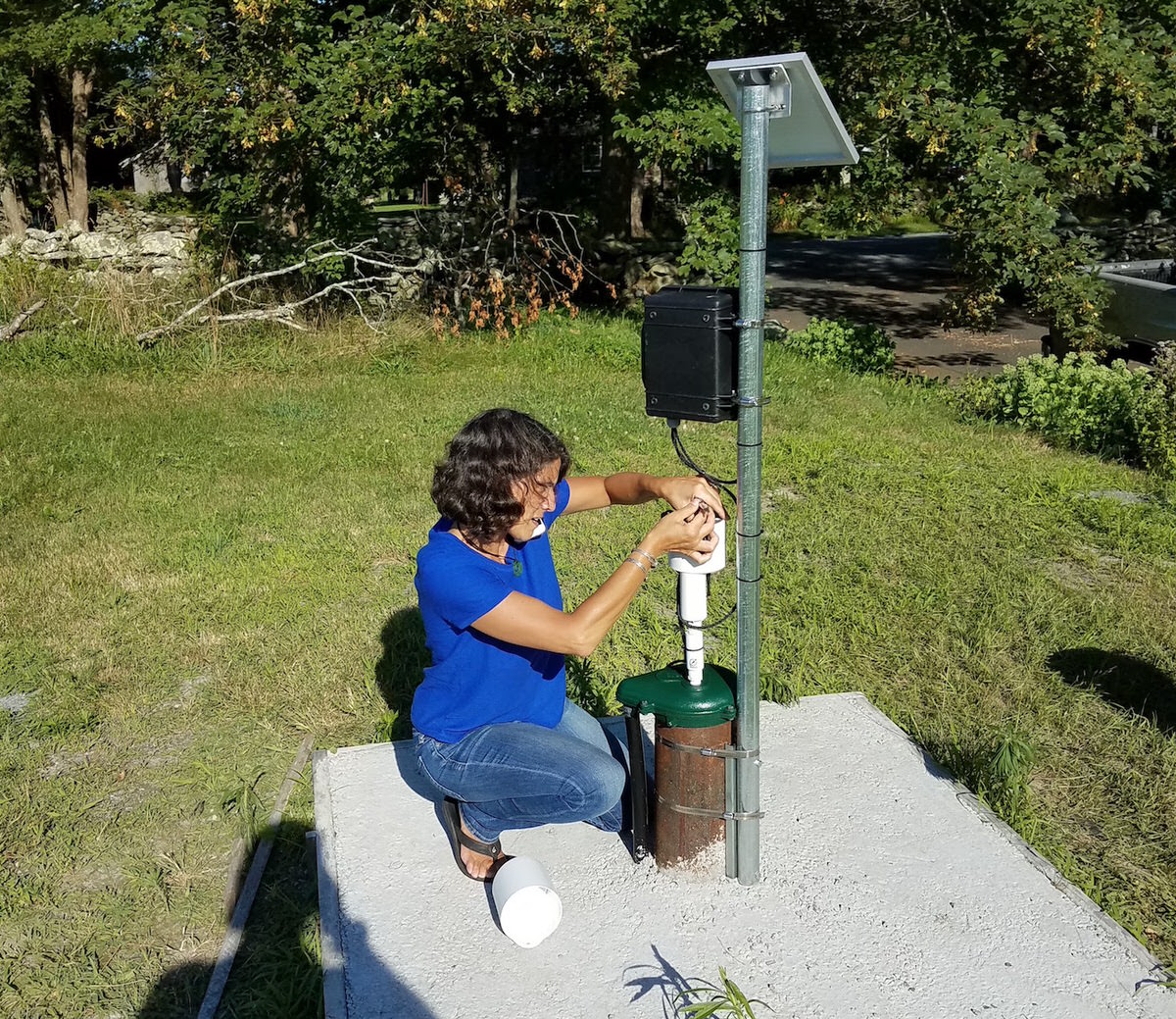 ImpactLABS deploying groundwater sensor.jpg