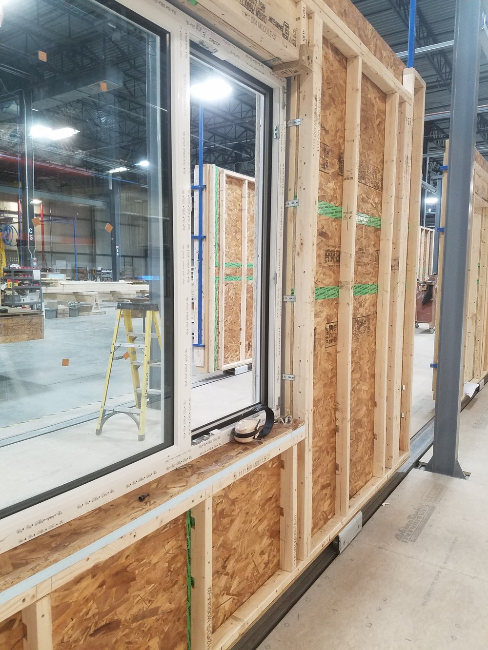 Wall panel with window being installed