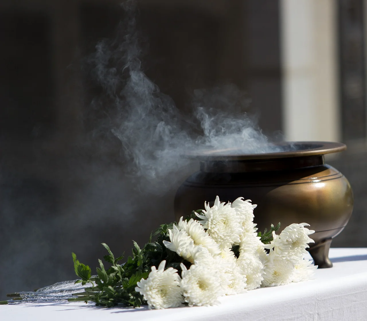 A Golden Urn with Incense and Flowers