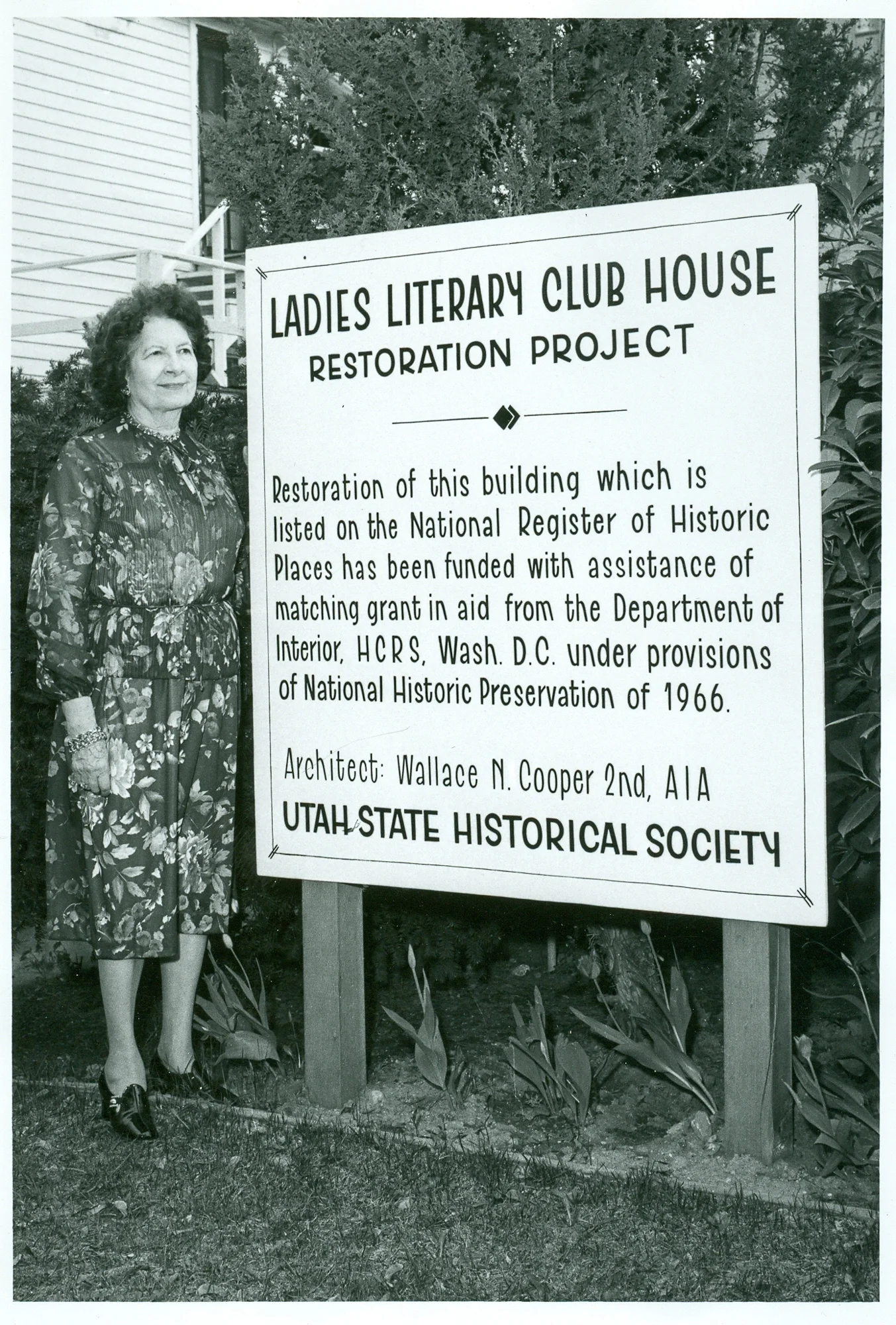 Image of former Ladies’ Literary Club member in front of project board for restoration grant in 1966. Image courtesy of the Utah State Historical Society.