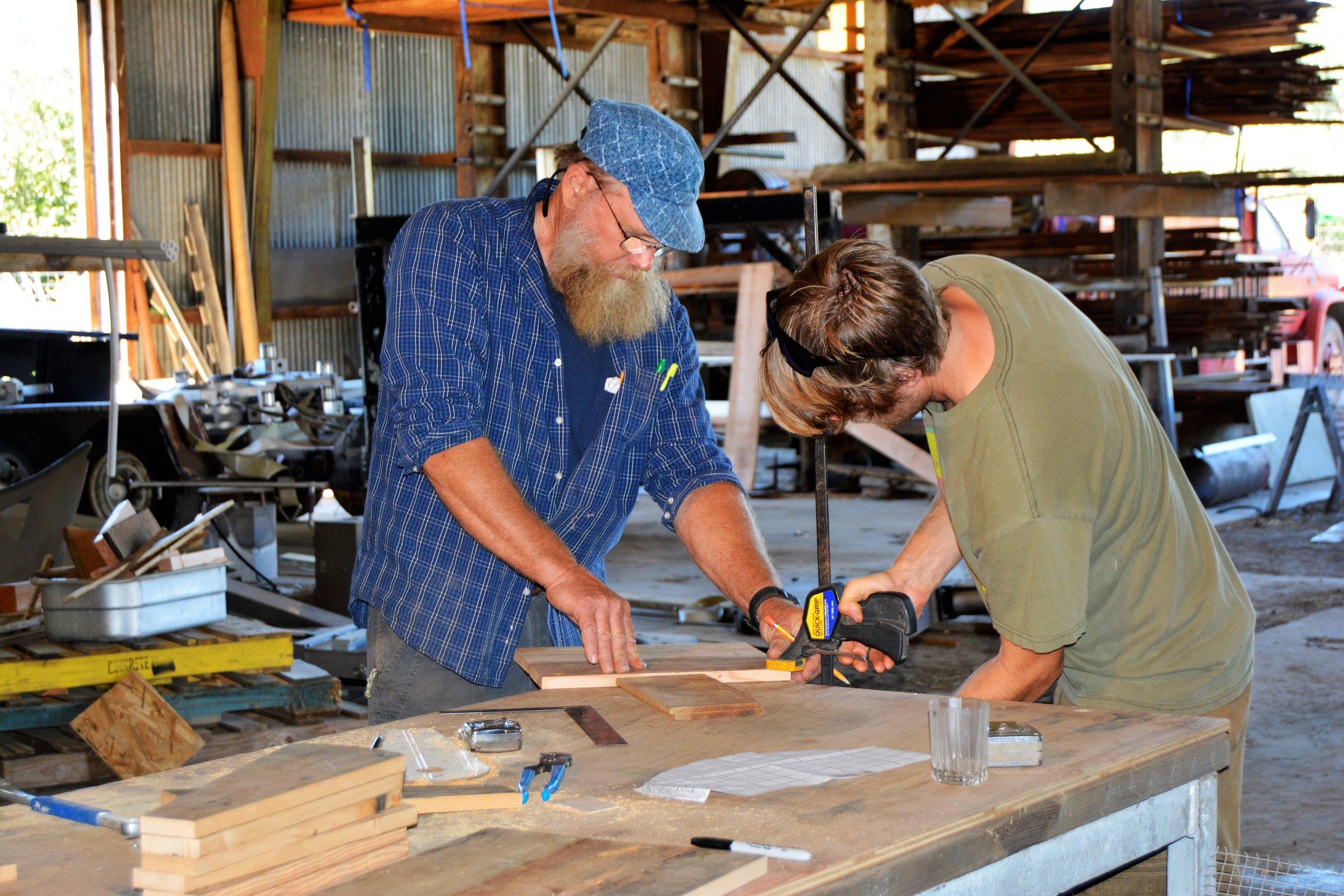 James and Steeve Moore building seed threshers in the Golden Rule woodshop.